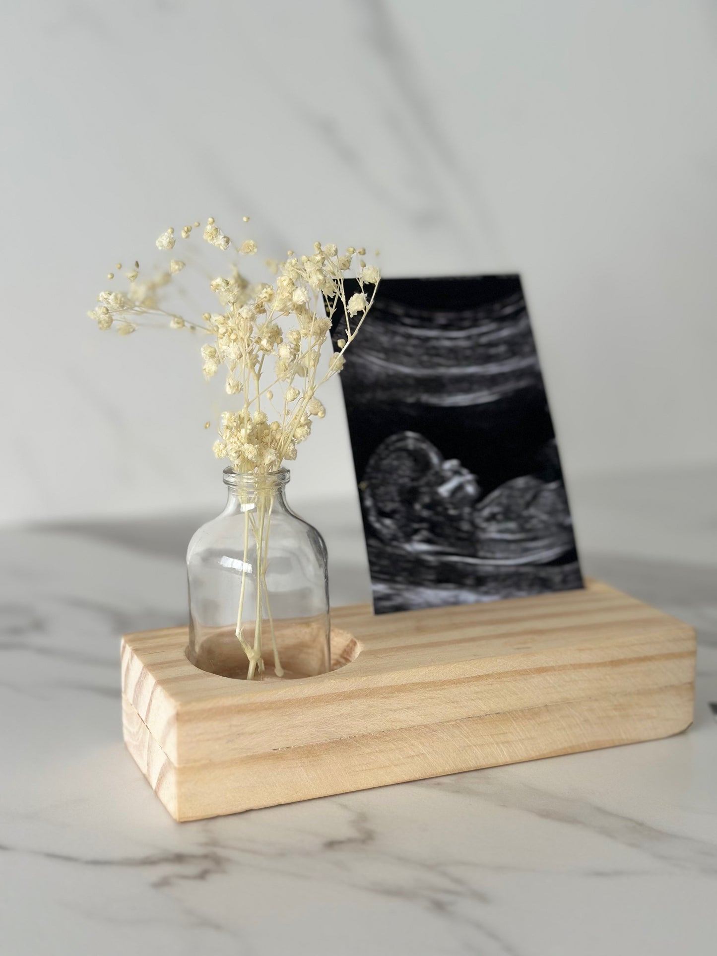 Portafoto con florero